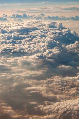 beautiful fluffy clouds from the window of the plane