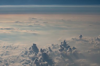beautiful fluffy clouds from the window of the plane