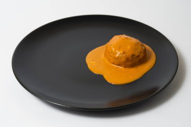 cutlet in sauce on a plate
