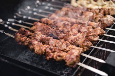 delicious and fragrant meat, skewers on grill 