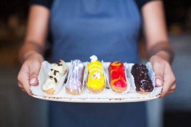 the chef cooked delicious  eclair on the tray