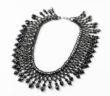 handmade colorful bead necklace close-up isolated on white background