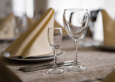 empty goblets and other cutlery are served on the festive table