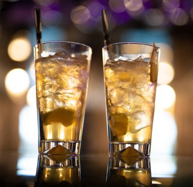 beautiful and delicious alcoholic cocktails prepared at the bar by the bartender