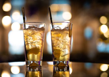 beautiful and delicious alcoholic cocktails prepared at the bar by the bartender