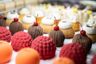 various delicious sweet pastries in the shop window