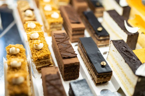 various delicious sweet pastries in the shop window