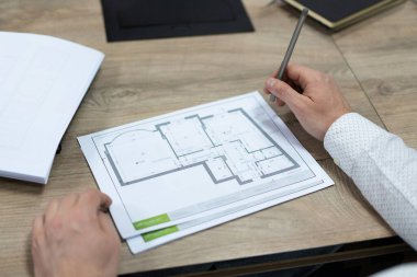 construction project drawings are discussed by construction company employees
