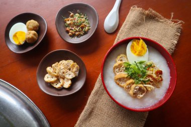 congee porridge with chicken slice, tofu, egg. congee porridge from hong kong. chinese food