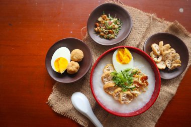 congee porridge with chicken slice, tofu, egg. congee porridge from hong kong. chinese food