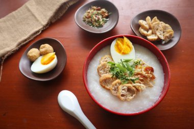 congee porridge with chicken slice, tofu, egg. congee porridge from hong kong. chinese food