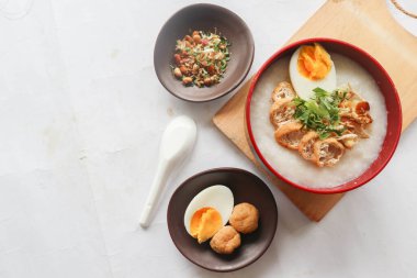 congee porridge with chicken slice, tofu, egg. congee porridge from hong kong. chinese food