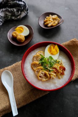 congee porridge with chicken slice, tofu, egg. congee porridge from hong kong. chinese food