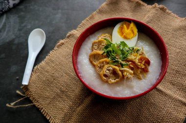 congee porridge with chicken slice, tofu, egg. congee porridge from hong kong. chinese food