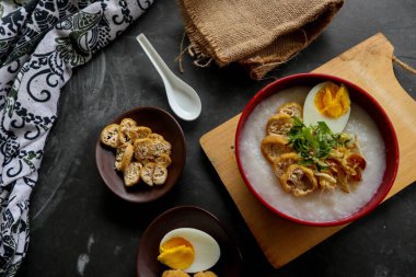 congee porridge with chicken slice, tofu, egg. congee porridge from hong kong. chinese food