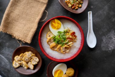 congee porridge with chicken slice, tofu, egg. congee porridge from hong kong. chinese food
