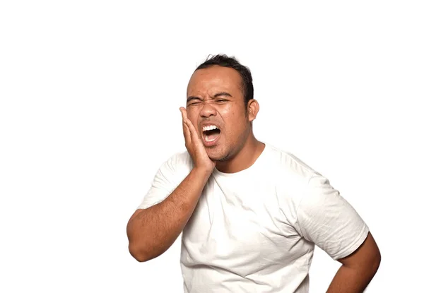 stock image Photo of man asia wearing white t shirt ill, Toothache with hurt emotion pain, isolated on white background