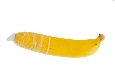 A banana is wrapped in a transparent condom on it. A metaphor of sex, sexuality, penis.