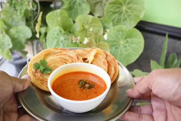 stock image Roti Canai or Paratha Bread with Curry Sauce, Chilli Flakes and Yogurt, Top View