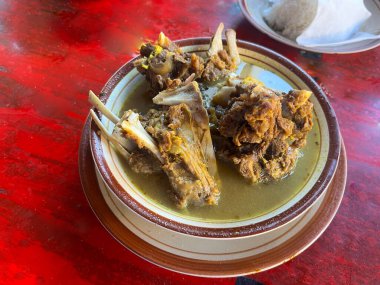 tengkleng kambing or goat tengkleng is a kind of soup with the main ingredient of goat bones. tengkleng like curry with goat bone material, bone soup clipart