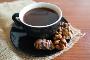 Kopi Luwak Coffee Bean or Civet coffee bean with Cup of Kopi Luwak coffee, world's most expensive coffee from indonesia clipart