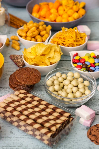 stock image Salty and sweet snacks. Table of salty and sweet snacks. Large group of unhealthy food