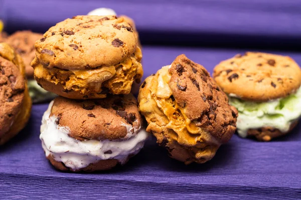 Chocolate chip ice cream cookie sandwiches with vanilla, chocolate and pistachios