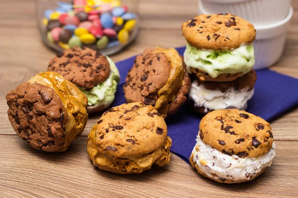 Chocolate chip ice cream cookie sandwiches with vanilla, chocolate and pistachios