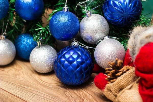 Silver and blue ornaments on the Christmas tree.  Christmas themes