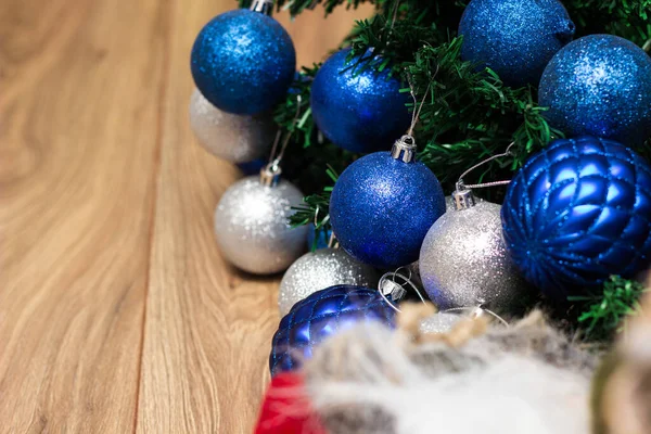Silver and blue ornaments on the Christmas tree.  Christmas themes