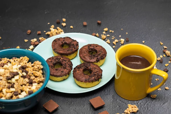 Chocolate granola muesli with chocolate milk,almonds, hazelnuts  and doughnuts