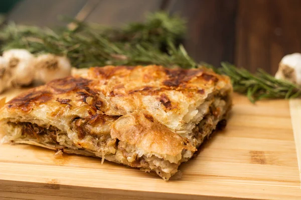 Savoury slice of pie with meat