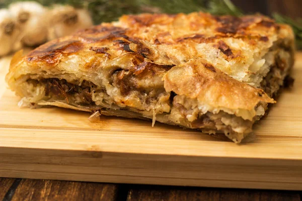 Savoury slice of pie with meat