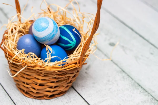 Painted Blue Easter Eggs Basket Old White Wood Background — Stockfoto