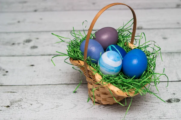 Painted Blue Easter Eggs Basket Old White Wood Background — Stockfoto