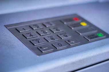 Entering personal identification number on ATM. Withdrawing money from a cash machine