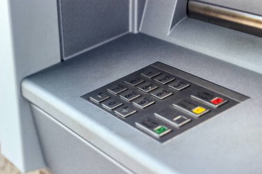 Entering personal identification number on ATM. Withdrawing money from a cash machine