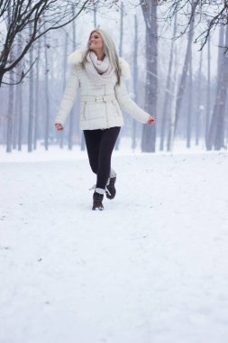 Joyful girl laughing and jumping