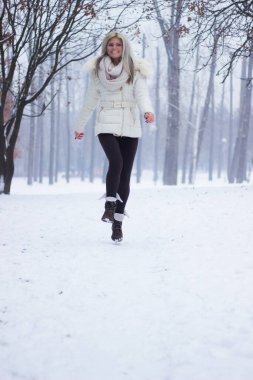 Joyful girl laughing and jumping