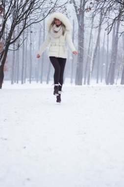 Joyful girl laughing and jumping