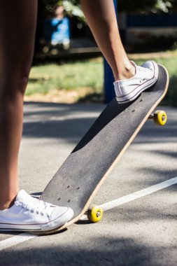 Speeding skateboarding legs, the basketball court