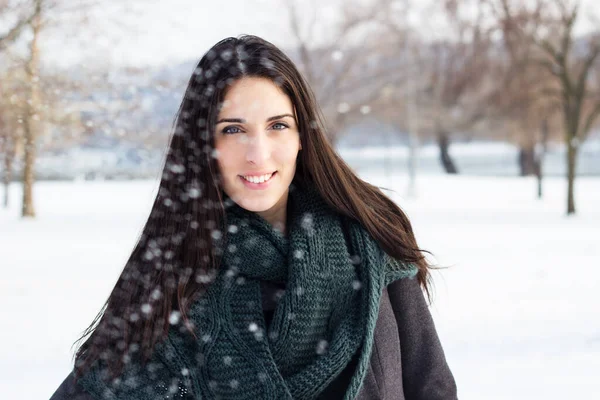 stock image Portrait of beautiful girl outdoors while showing. Winter beauty smiling