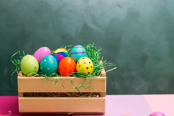 Colorful collection of easter eggs in crate