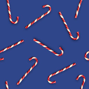 Parlak mavi arka planda noel şekerleri ile kusursuz desen. Yaratıcı asgari Xmas sanatı. Uzayı kopyala Minimum bileşim. Düz yatıyordu.