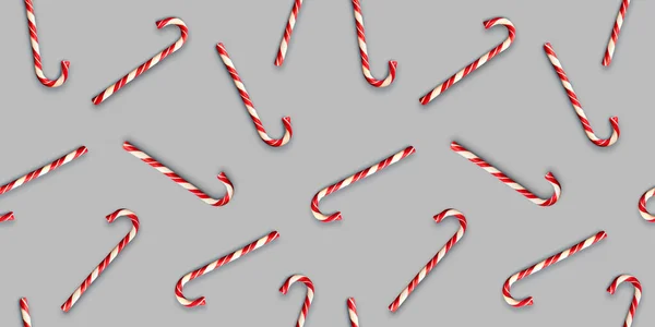Seamless pattern with Christmas candies on bright gray background. Creative minimal X mas art. Copy space. Minimal composition. Flat lay.