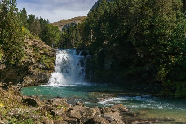 stock image waterfall in Ordesa valley during autumn in the pyrenees mountains, Ordesa and Monte Perdido National Park, Huesca, Aragon, Spain