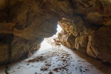 view out of the cave at the ocean