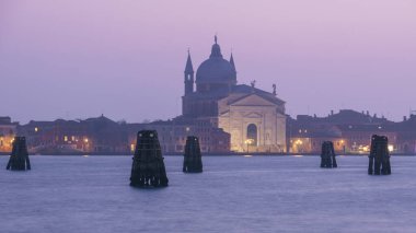 Il Redentore church on Giudecca island on a hazy winter evening during blue hour, Venice, Veneto, Italy clipart