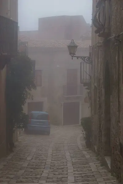 stock image Townscape of medieval streets covered in mist on a foggy day, Erice, Sicily, Italy