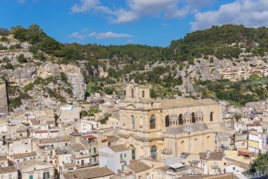 Cityscape of small town in mountains on a sunny spring day, Scicli, Sicily, Italy clipart